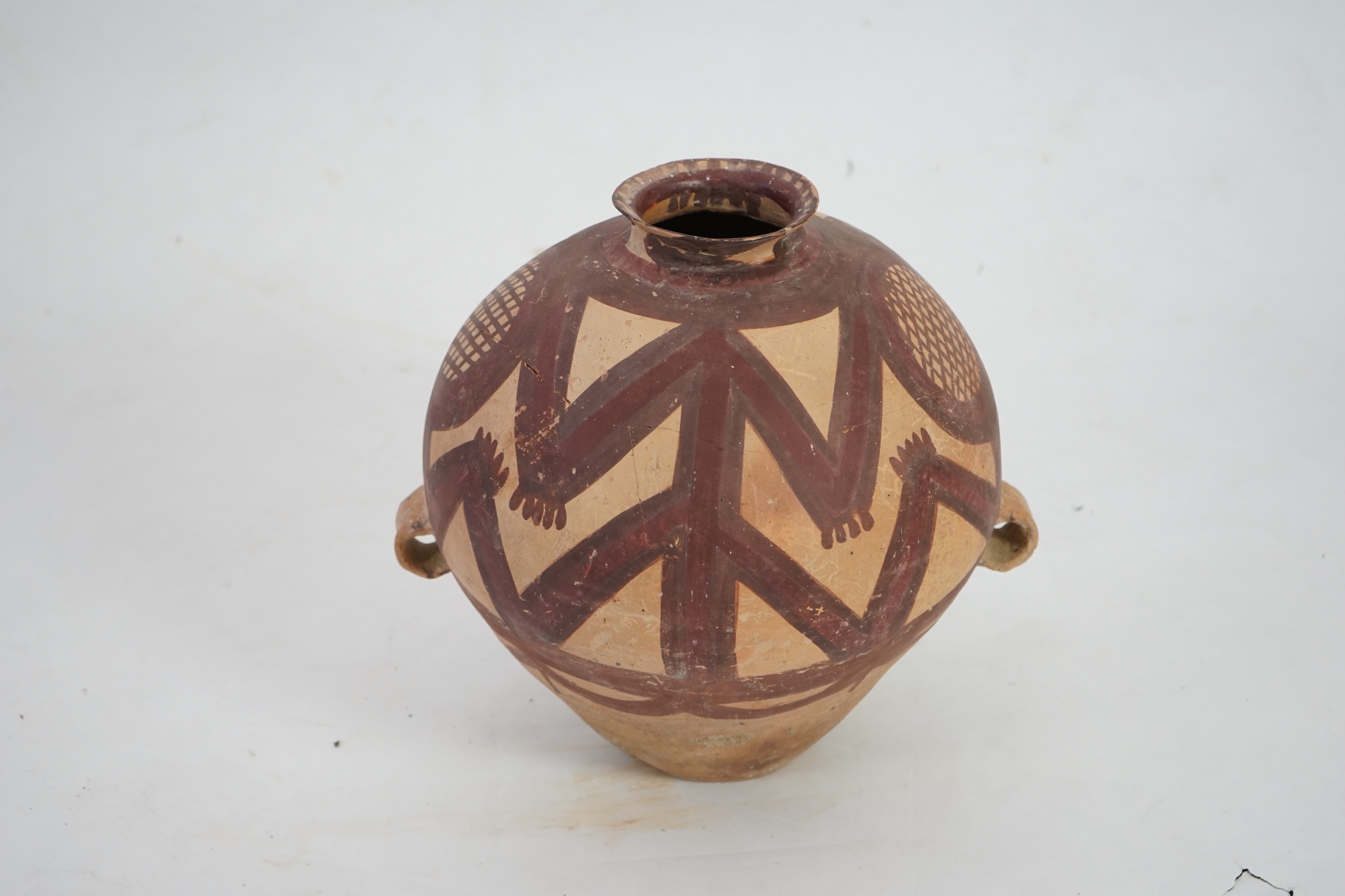 A large Chinese Neolithic Machang painted pottery jar, c.2300-2000 BC) of the Majiayao culture